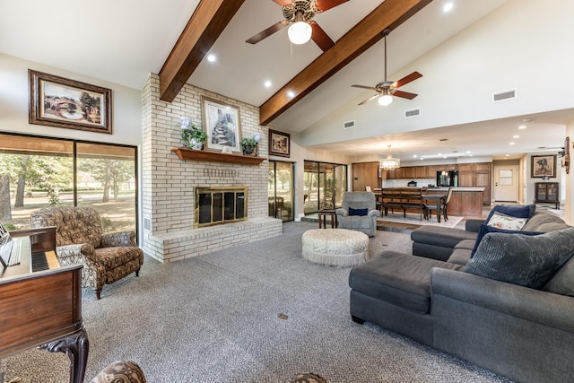 carpeted living room featuring ceiling fan, a fireplace, high vaulted ceiling, and beamed ceiling