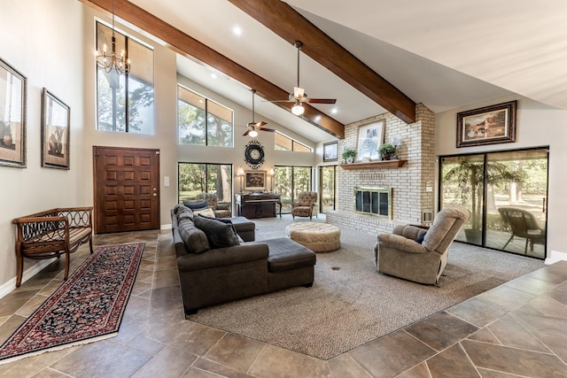 living room with ceiling fan with notable chandelier, beam ceiling, high vaulted ceiling, and a brick fireplace