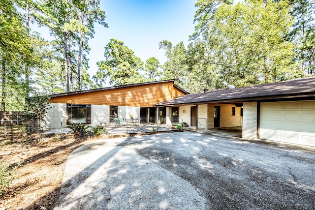 view of front of property with a garage