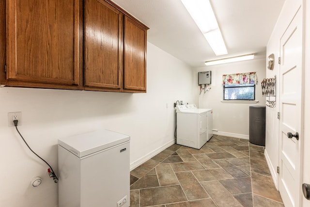 laundry area with cabinets and washing machine and clothes dryer