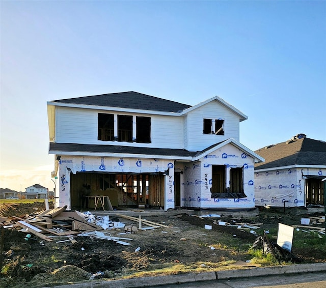 unfinished property with a garage