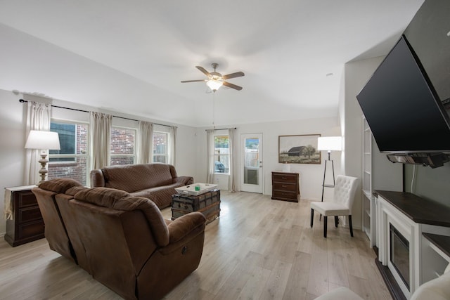 living room featuring ceiling fan and light hardwood / wood-style floors