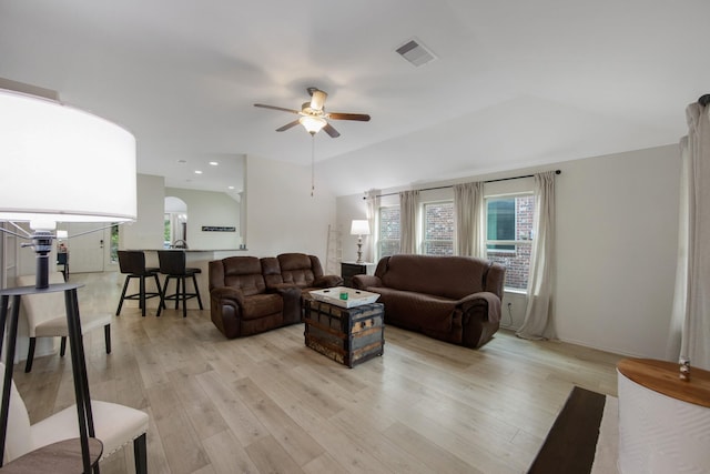 living room with ceiling fan and light hardwood / wood-style floors