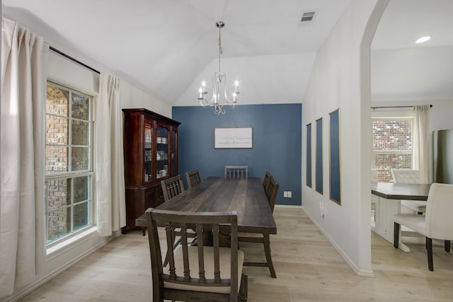 dining space with plenty of natural light and light hardwood / wood-style flooring