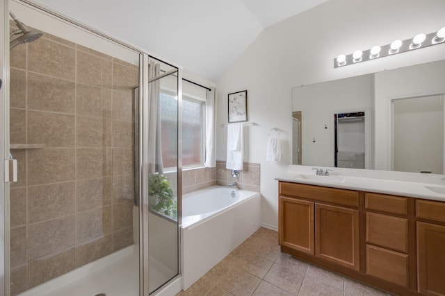 bathroom featuring tile patterned flooring, independent shower and bath, and lofted ceiling