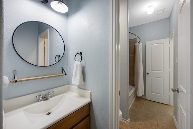 full bathroom with toilet, shower / tub combo, vanity, and tile patterned floors