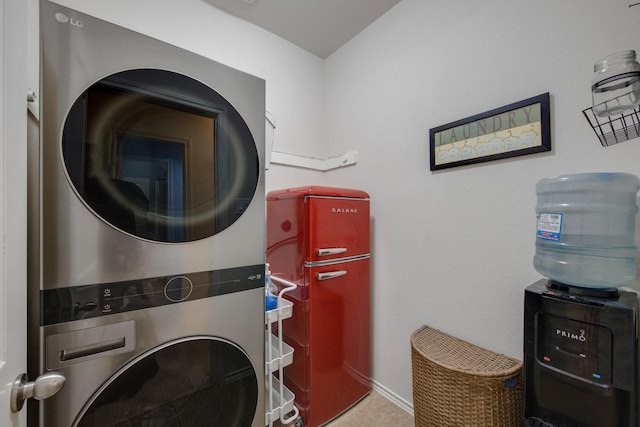 washroom featuring stacked washing maching and dryer