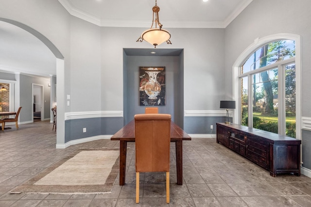 dining area with crown molding