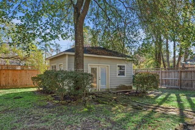 view of outdoor structure with a lawn