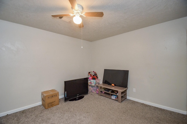 rec room featuring a textured ceiling, carpet floors, and ceiling fan