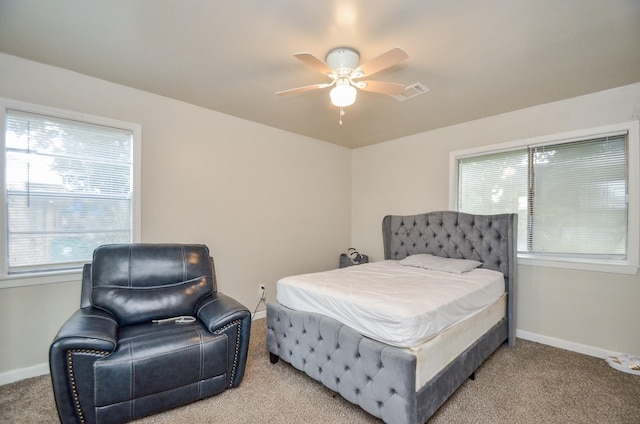 carpeted bedroom featuring ceiling fan