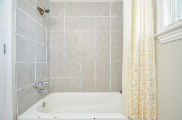 bathroom featuring shower / bath combination with curtain