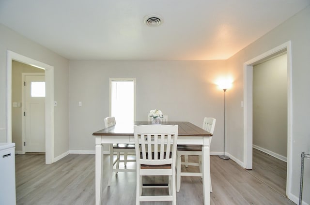 dining space featuring light hardwood / wood-style flooring