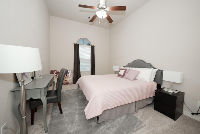 carpeted bedroom featuring ceiling fan and vaulted ceiling