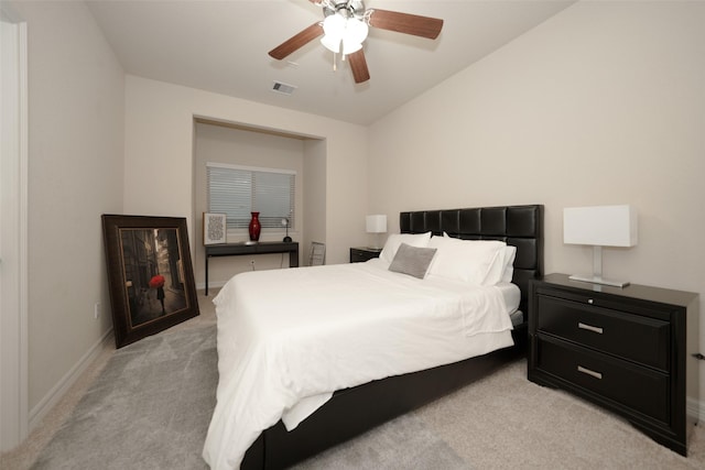 carpeted bedroom featuring ceiling fan and lofted ceiling