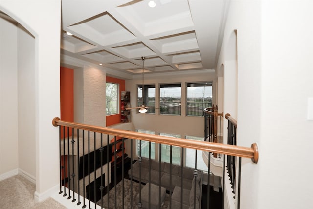 stairs featuring beam ceiling, carpet, coffered ceiling, and ornamental molding