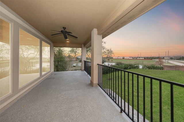 balcony at dusk with ceiling fan