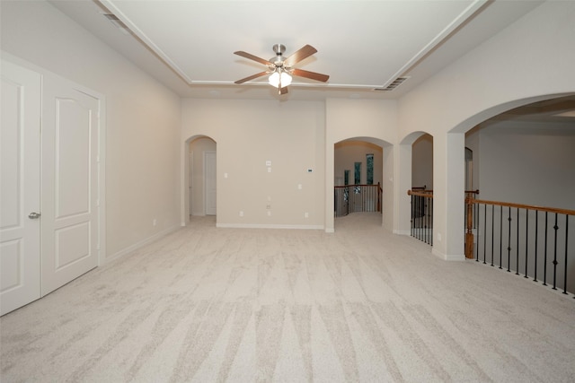 carpeted spare room with ceiling fan