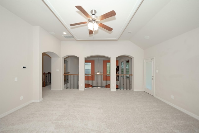 spare room with light colored carpet, ceiling fan, and lofted ceiling