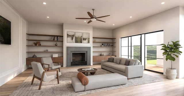 living room with light hardwood / wood-style flooring and ceiling fan