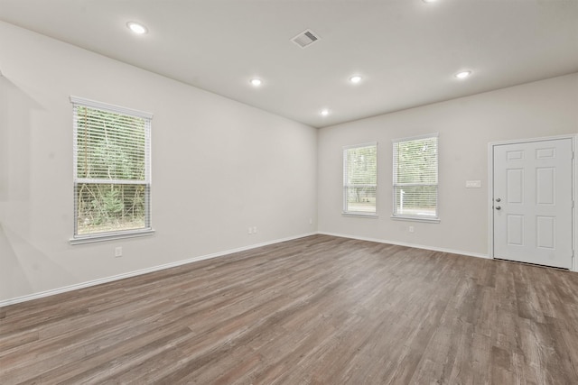 spare room with light hardwood / wood-style floors