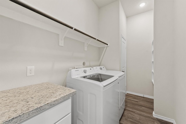 washroom with dark hardwood / wood-style floors and separate washer and dryer