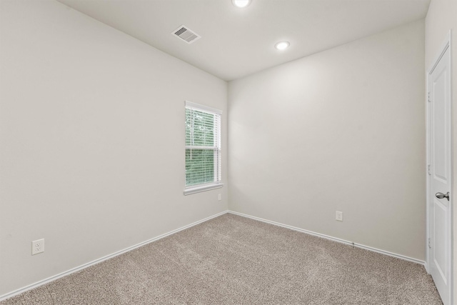 unfurnished room featuring carpet