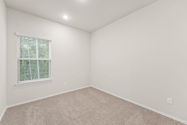 empty room with carpet flooring