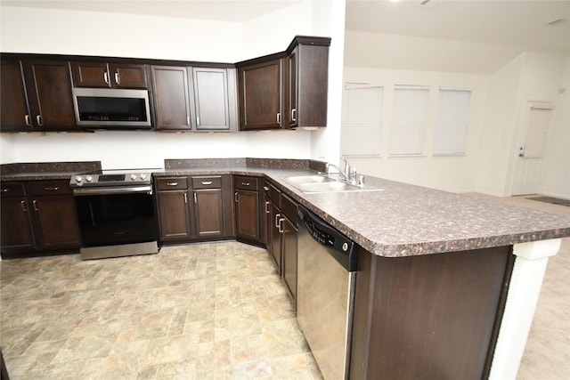 kitchen with dark brown cabinets, sink, and stainless steel appliances