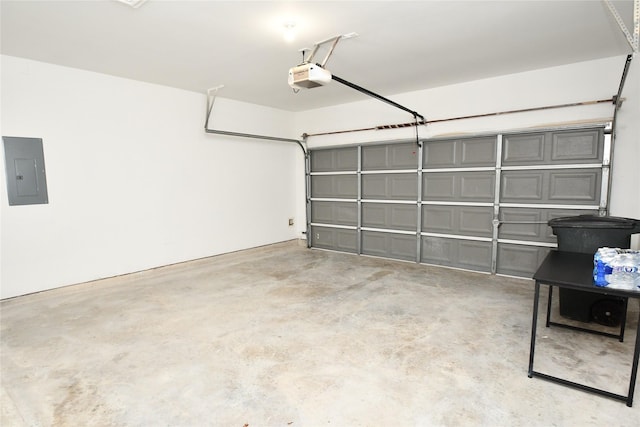 garage featuring electric panel and a garage door opener