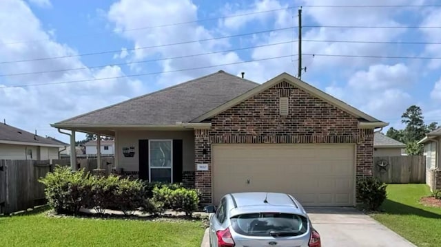 view of front of house featuring a front lawn and a garage