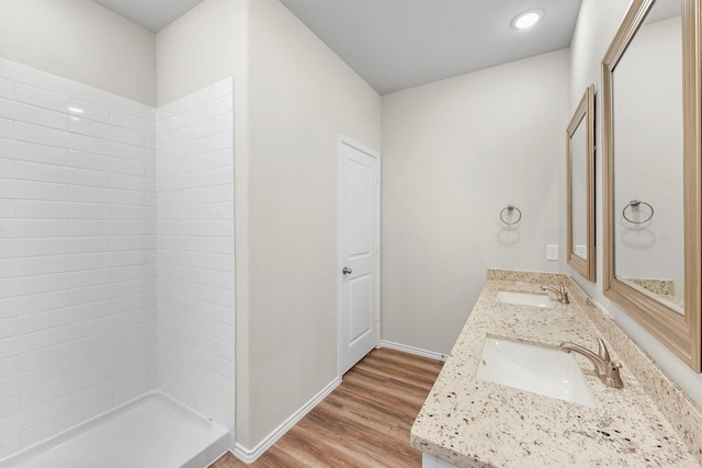 bathroom featuring vanity, hardwood / wood-style flooring, and walk in shower