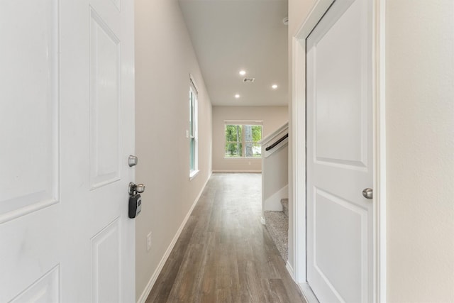 hallway featuring dark hardwood / wood-style floors