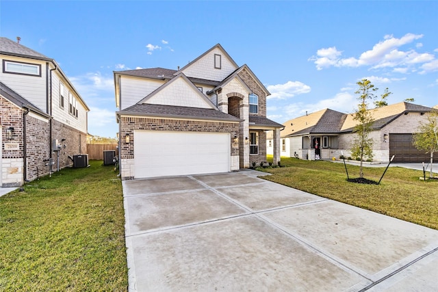 view of front of property featuring a front yard, central AC, and a garage