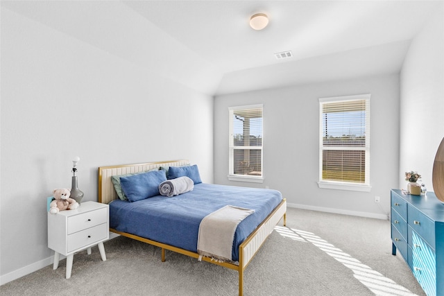 carpeted bedroom featuring vaulted ceiling