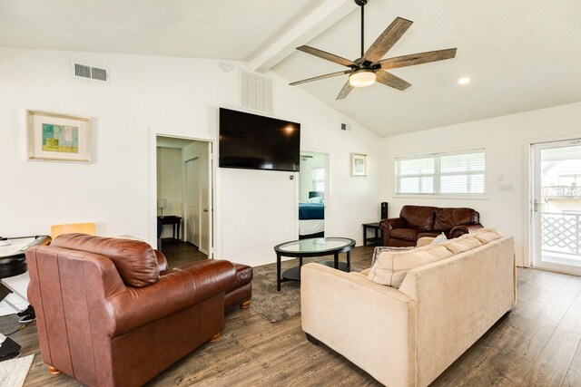 living room with ceiling fan, dark hardwood / wood-style floors, and vaulted ceiling with beams