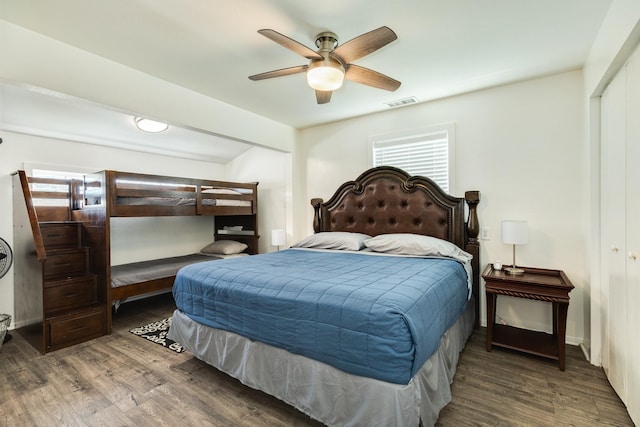 bedroom with dark wood-type flooring and ceiling fan