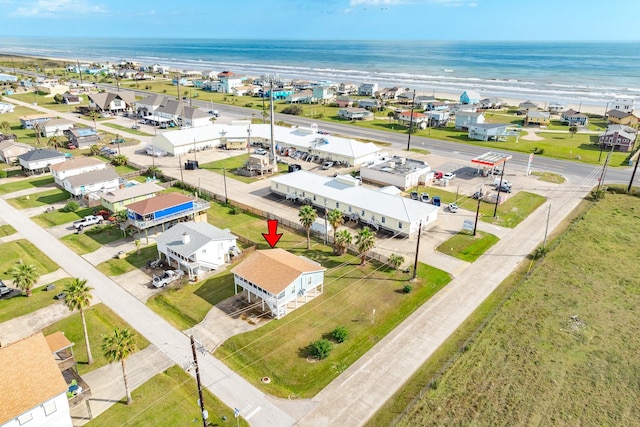 aerial view with a water view and a view of the beach