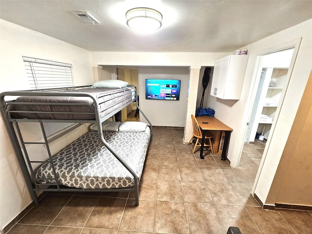 bedroom featuring tile patterned floors