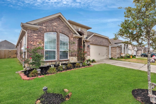 view of front of property featuring a garage and a front yard