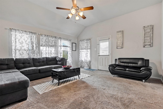 carpeted living room with ceiling fan, a healthy amount of sunlight, and lofted ceiling