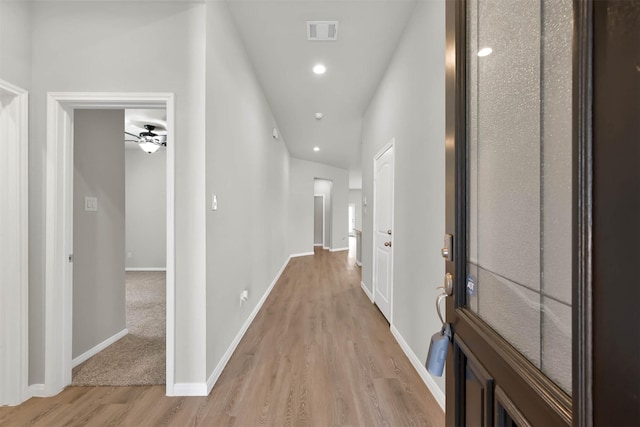 hall with light hardwood / wood-style floors