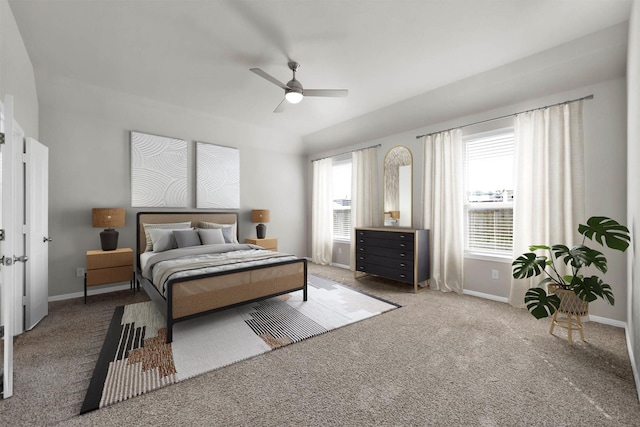 carpeted bedroom featuring multiple windows and ceiling fan