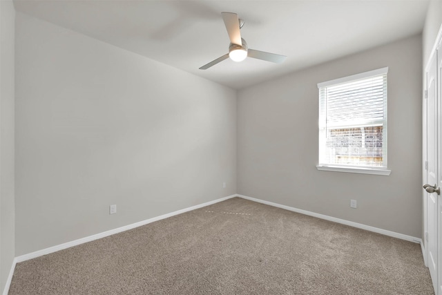 carpeted empty room with ceiling fan