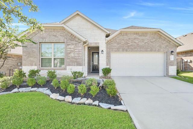 view of front of house featuring a garage and a front yard