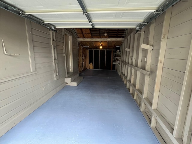 garage with wood walls