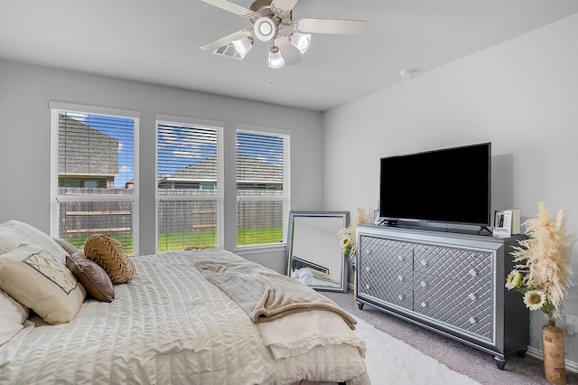 carpeted bedroom featuring ceiling fan