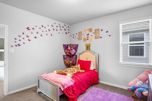 bedroom featuring dark carpet