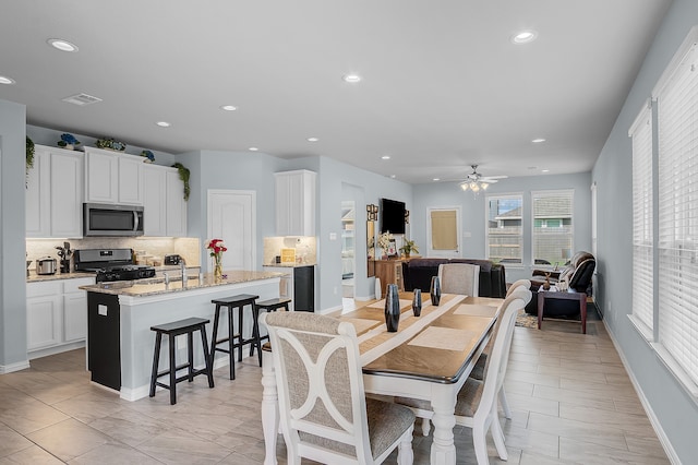 dining space featuring ceiling fan