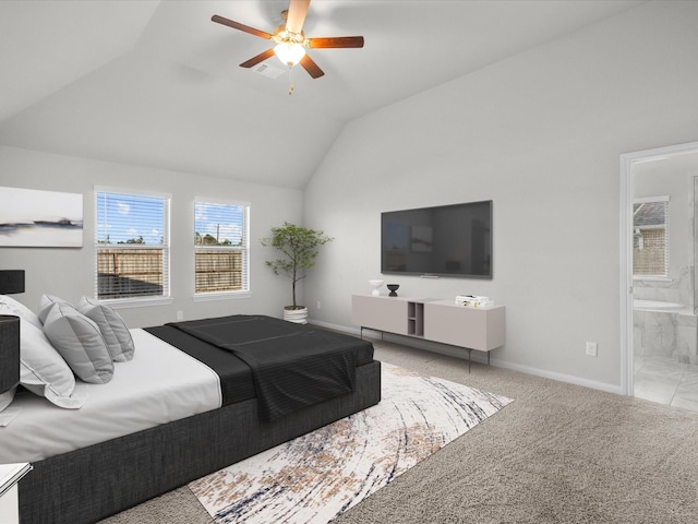 carpeted bedroom featuring ensuite bath, ceiling fan, and lofted ceiling